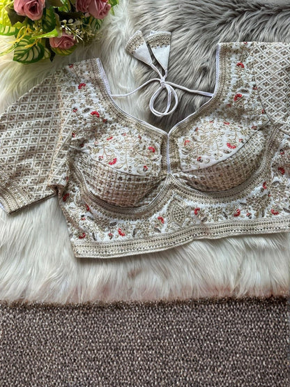 AMAB Sabyasachi-inspired bridal blouse in white Roman silk with heavy gold zari and sequence embroidery. Features a back-open design with latkans.