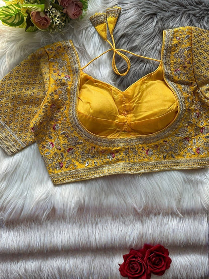 AMAB Sabyasachi-inspired yellow Roman silk bridal blouse with gold zari and sequence embroidery. Back open design with handmade hooks.
