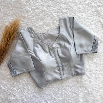AMAB silver pure silk blouse with elastic fit and padded comfort. V-neck, short sleeves with smocked cuffs.