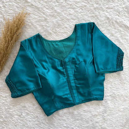 AMAB teal pure silk blouse with elastic fit, padded, V-neck, and smocked sleeves.