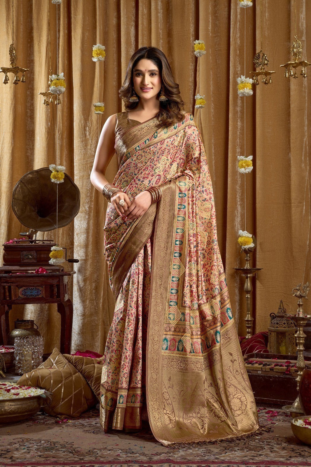 AMAB Traditional Indian Silk Sari in blush pink with intricate weave, gold border, and detailed pallu. Model wears it for a festive occasion.