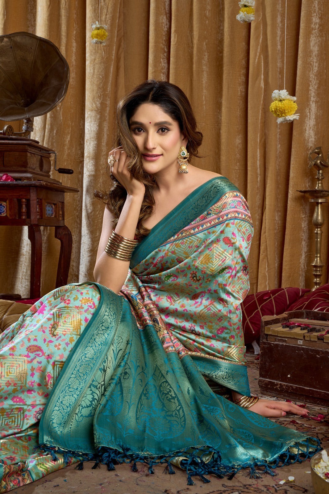 AMAB Traditional Indian Silk Sari in teal with intricate weave, floral and geometric patterns, and a contrasting border.