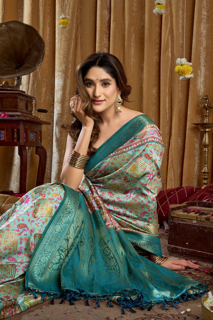 AMAB Traditional Indian Silk Sari in teal with intricate weave, floral and geometric patterns, and a contrasting border.