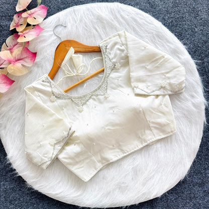 AMAB white silk blouse with all-over handwork and pearl embellishments, padded, 3/4 sleeves, ideal for festive wear.