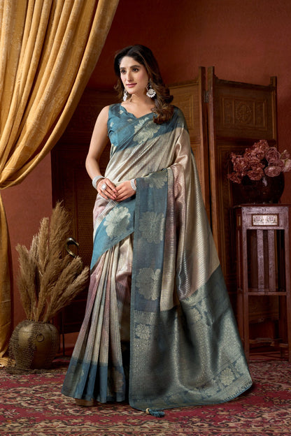 AMAB Women's traditional woven silk blend saree in beige with blue border and floral motifs. Elegant, shimmering fabric.