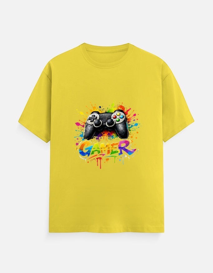 AMAB yellow cotton t-shirt with a black video game controller graphic and colorful paint splatters, text reads GAMER.