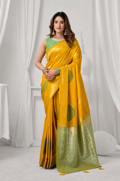 AMAB yellow Kanjeevaram silk saree with green border and circular motifs. Intricate zari work.