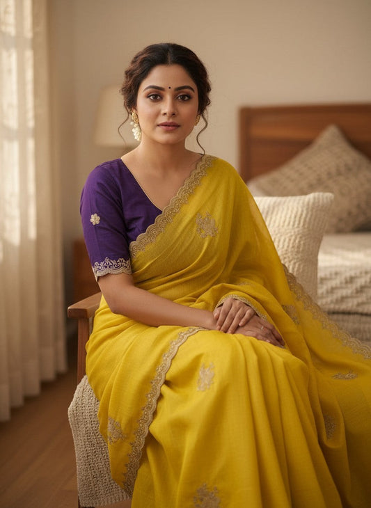 AMAB yellow silk blend saree with purple embroidered blouse and lace border